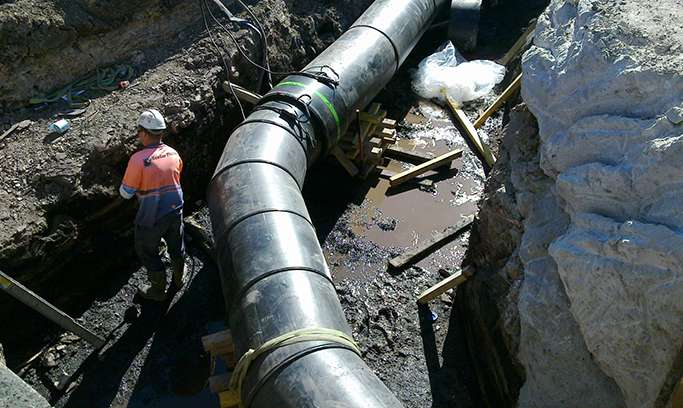 Black underground pipe showing an example of a King PipeGrade® application