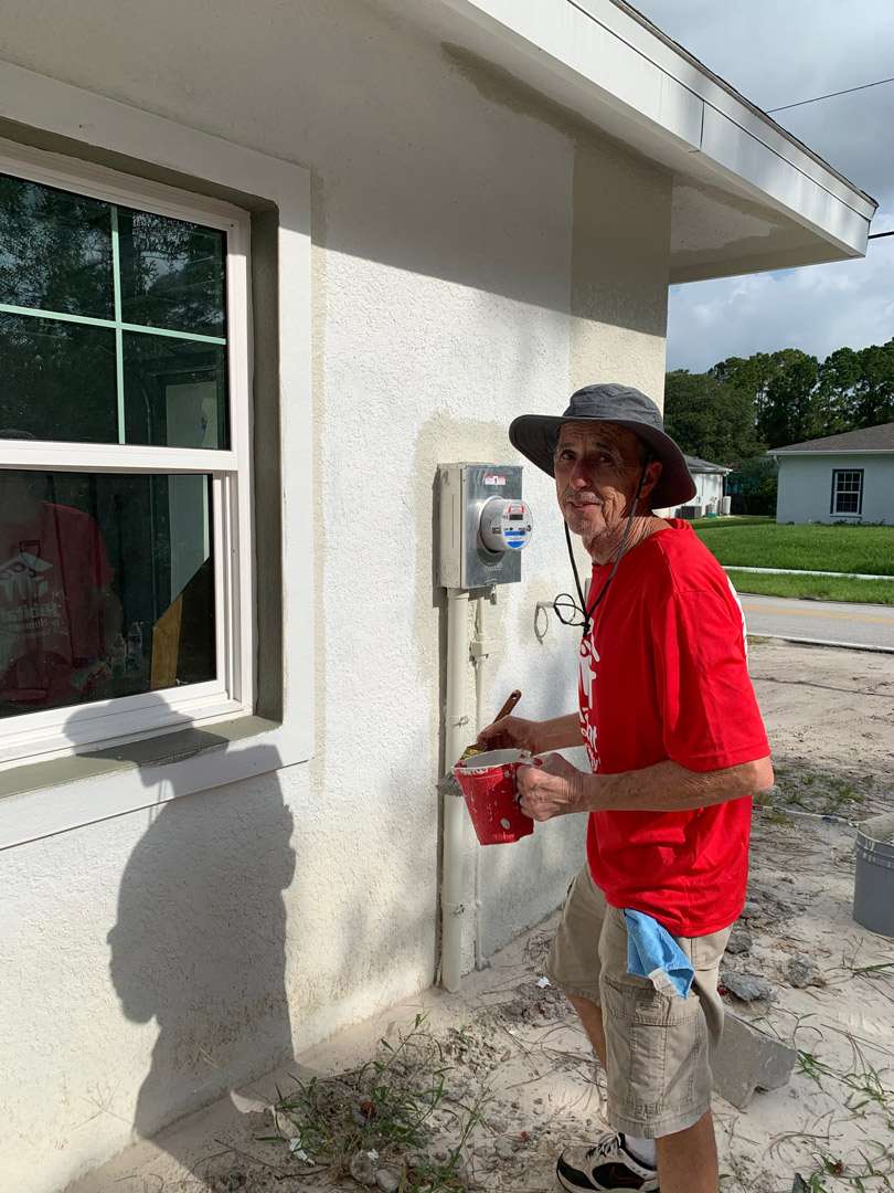 a person holding a red box