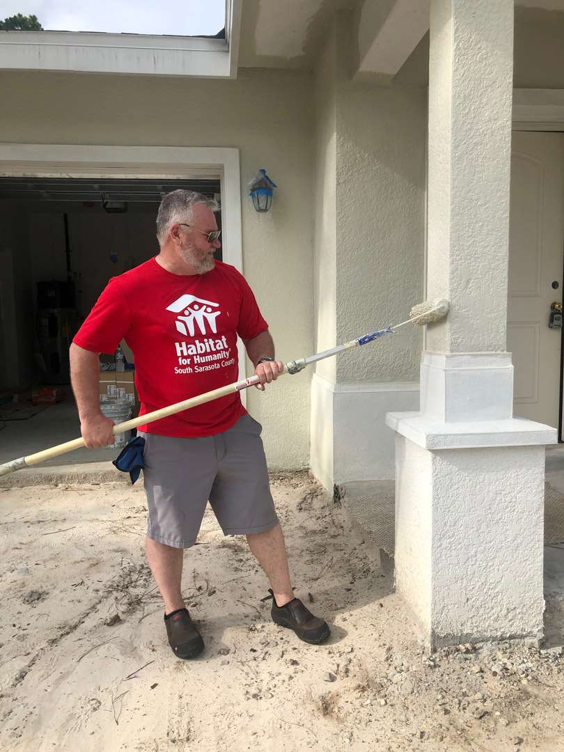 a person holding a broom